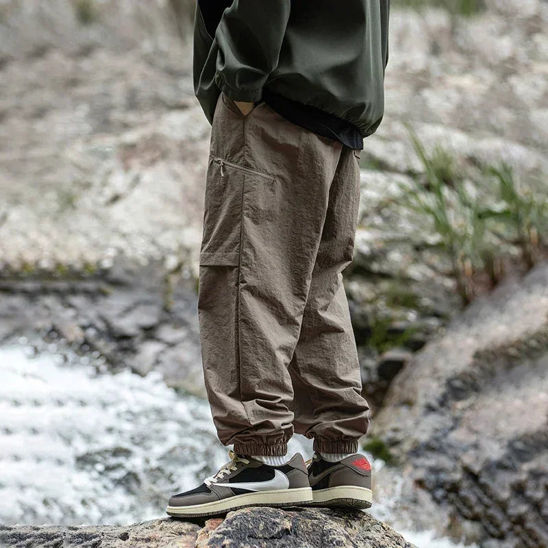TFETTERS Autumn Men Cargo Pants 2025 Multi Pocket Waterproof Solid Color Casual Pants 100% Nylon Outdoors Tourism Men Clothes