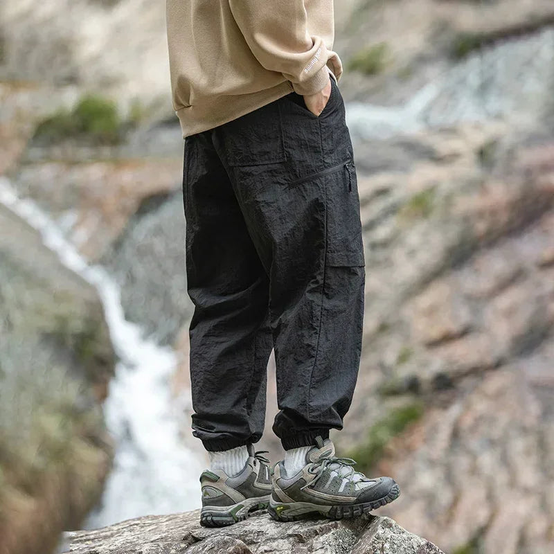 TFETTERS Autumn Men Cargo Pants 2025 Multi Pocket Waterproof Solid Color Casual Pants 100% Nylon Outdoors Tourism Men Clothes
